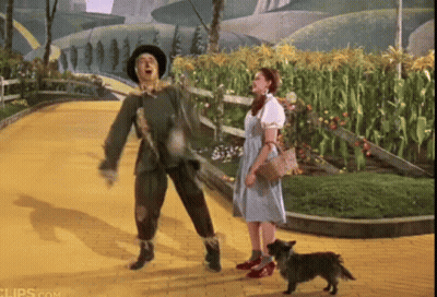 Scarecrow Dancing With Woman And Dog GIF