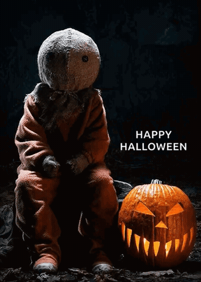 Espantapájaros junto a calabaza tallada Feliz Halloween GIF