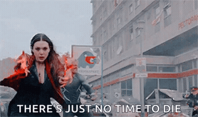 Scarlet Witch Is Holding A Fireball In Front Of A Building And Says `` There 'S Just No Time To Die `` . GIF