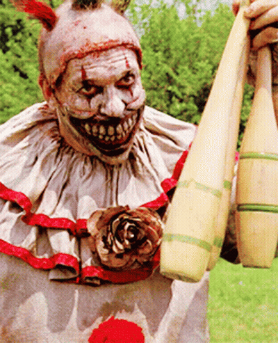 Scary Clown Holding Kettlebells GIF