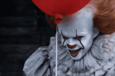 Scary Clown Holding Red Balloon GIF