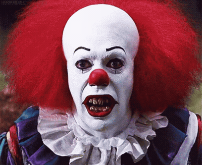 Scary Clown With Red Hair And White Face Paint GIF