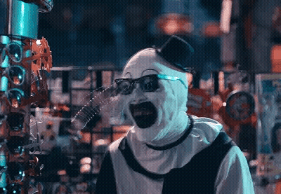 Scary Clown With Top Hat And Glasses In Store GIF