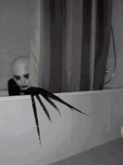 Scary Creature Sticking Head Out Of Bath Tub GIF