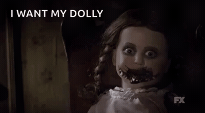 Scary Doll Sitting In Chair Saying I Want My Doll GIF