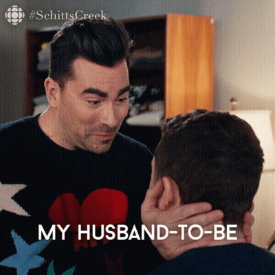 Schitt's Creek Two Men Touching Faces GIF