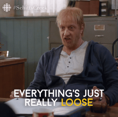 Schitts Creek Ad Man Sitting At Desk GIF
