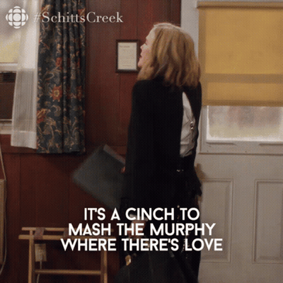 Schitts Creek Poster Woman Holding Purse GIF