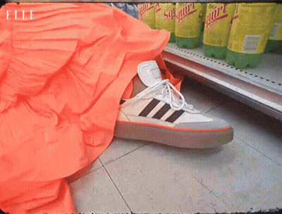 Schweppes Bottle Next To Shoe GIF
