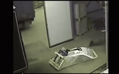 Scissors Laying On Dark Room Floor GIF