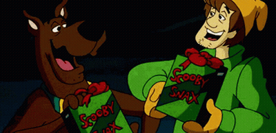 Scooby Doo And Shaggy Are Holding A Box That Says Scooby Snax On It GIF