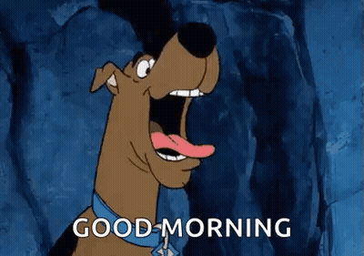 Scooby Doo Is Saying Good Morning With His Mouth Open And His Tongue Out . GIF