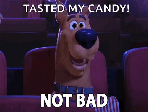 Scooby Doo Is Sitting In A Theater With The Words Tasted My Candy Not Bad Above Him GIF