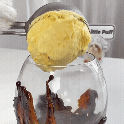 Scoop Of Ice Cream Poured Into Glass Saying Little Puff GIF