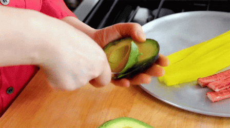 Scooping Avocado Fruit Removing Skin GIF