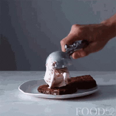 Scooping Ice Cream Onto Brownie GIF