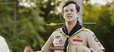 Scout With Arrow Through Neck Saying Flower GIF