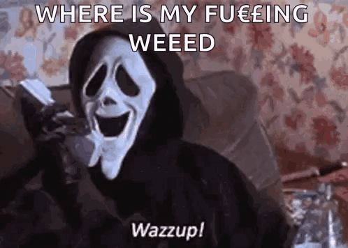 Scream From The Movie Scary Movie Is Sitting On A Couch Holding A Cell Phone . GIF