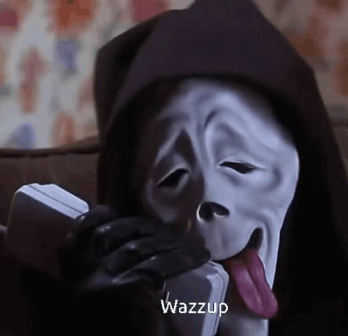 Scream Is Talking On A Phone With His Tongue Out . GIF