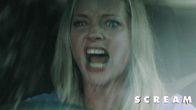 Screaming Woman In Car With Scream Text GIF