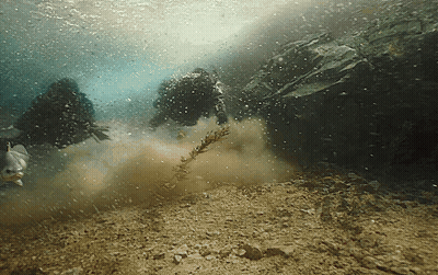 Scuba Divers Swimming Underwater GIF