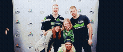 Seahawks Fans Posing In Front Of Wall GIF
