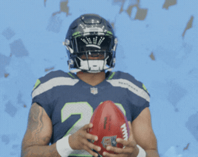 Seahawks Football Player Holding Football GIF