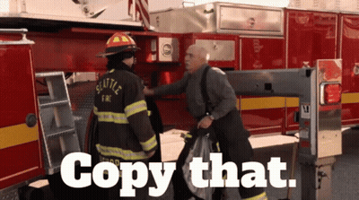 Seattle Fireman Talking To Another Man GIF