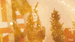 Secret Santa With Friends Holding Gift GIF