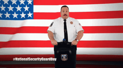 Security Guard In Front Of American Flag GIF