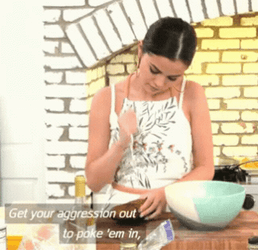 Selena Gomez Stabbing Vegetable With Fork GIF