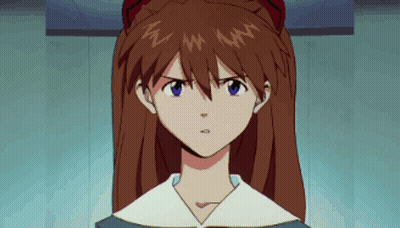 Serious Redhead Girl With Blue Eyes Looking At Camera GIF