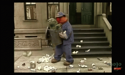 Sesame Street Character Holding Trash Can GIF