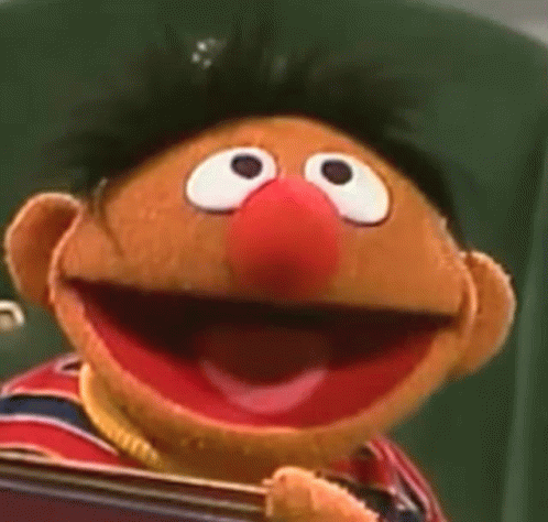 Sesame Street Puppet Holding Book Smiling GIF
