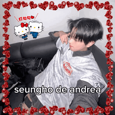 Seungho De Andrea Is Sitting On A Couch With Hello Kitty GIF