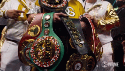 Several Boxing Belts Are Displayed Including One That Says Wbc On It GIF
