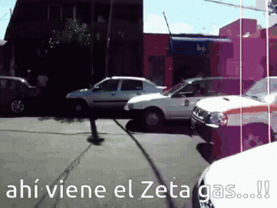 Several Cars Are Parked On The Side Of The Road With The Words Ahi Viene El Zeta Gas Written On The Bottom GIF