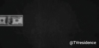 Several Hundred Dollar Bills Are Lined Up On A Black Background GIF