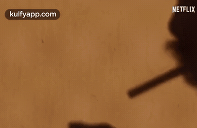 Shadow Person Holding Pen Netflix Logo GIF