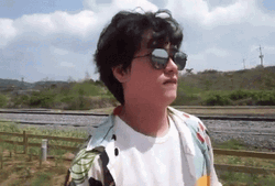 Shake Fist Man Wearing Shades GIF