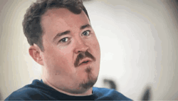 Shane Gillis Wicked Smile Raising Brows GIF