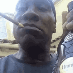 Shannon Sharpe Holding Wine Bottle GIF
