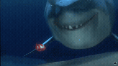 Shark With Clown Fish In Mouth GIF
