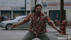 Sharknado Falling Over A Guy GIF