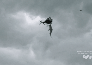 Sharknado Helicopter Flying With Sharks GIF