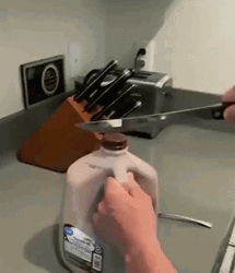 Sharp Knife Cutting Choco Milk Gallon GIF