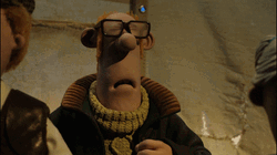 Shaun The Sheep Dog Waves On Auctioneer GIF