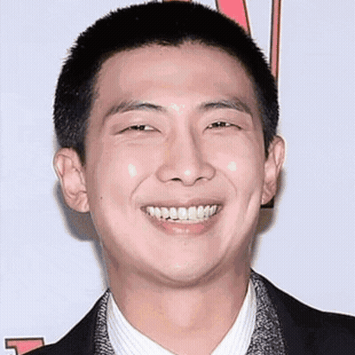 Shaved Head Man Smiling In Suit And Tie GIF