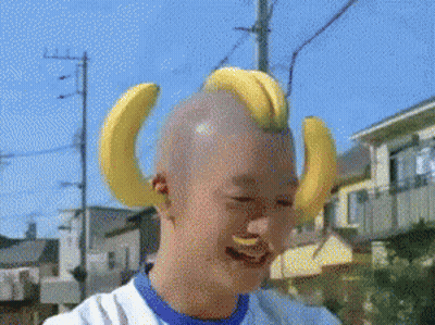 Shaved Head With Bananas On Ears GIF