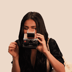 Shay Mitchell Using Polaroid Camera